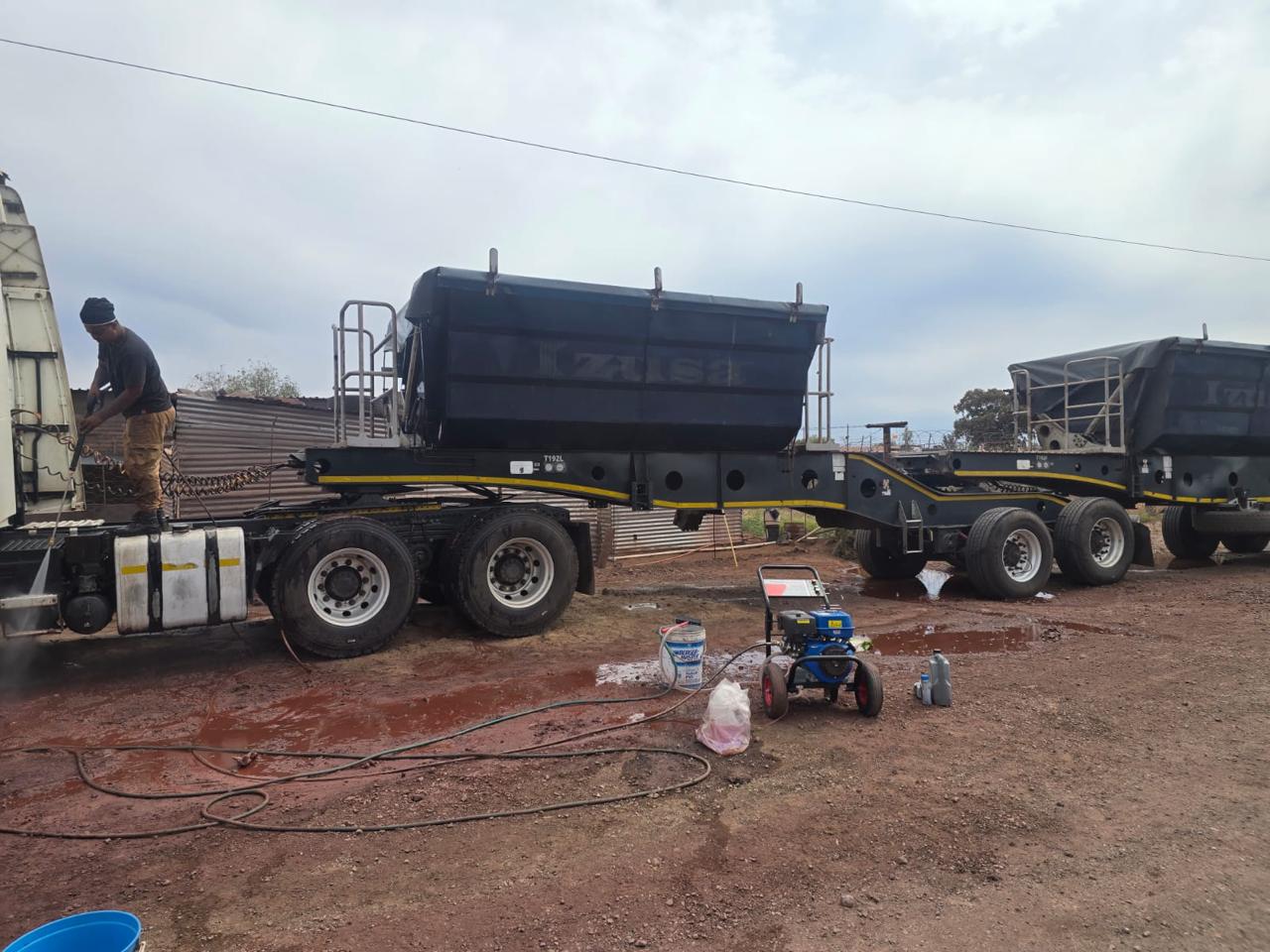 Truck and trailer being professionally cleaned